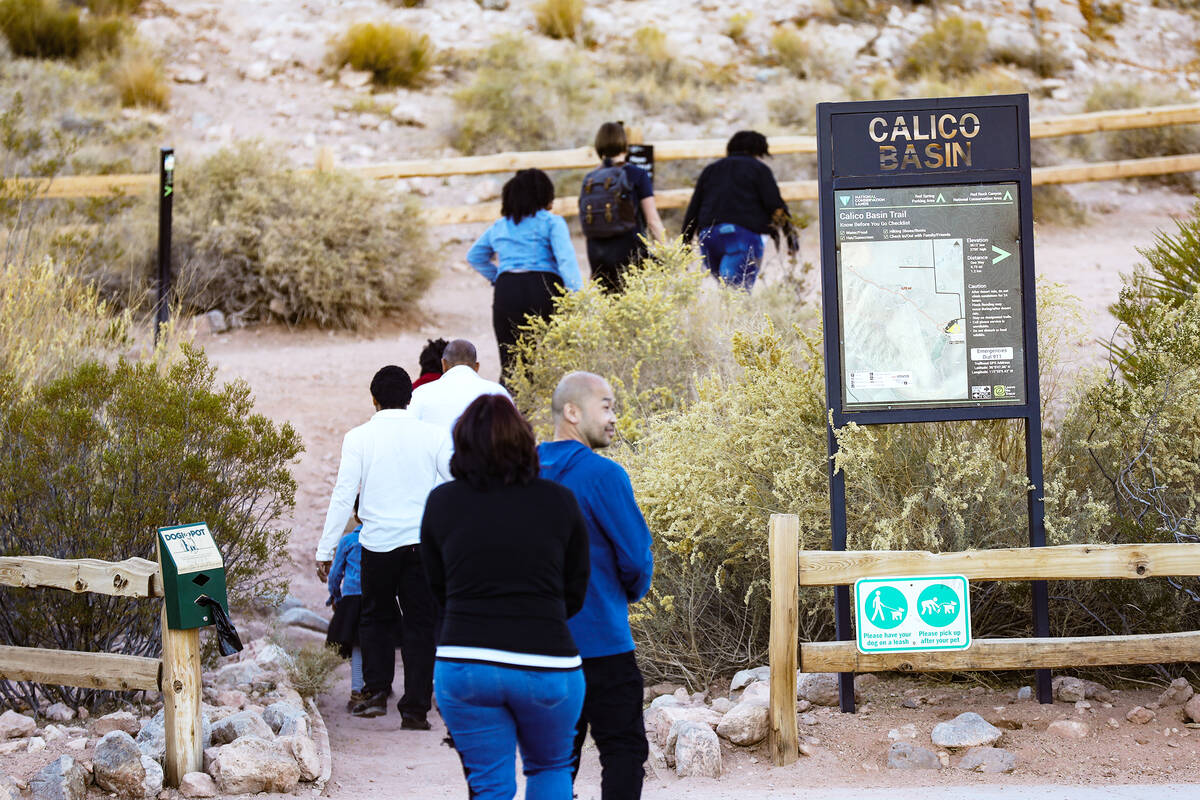 Visitors enter Calico Basin on the eastern edge of the Red Rock Canyon National Conservation Ar ...