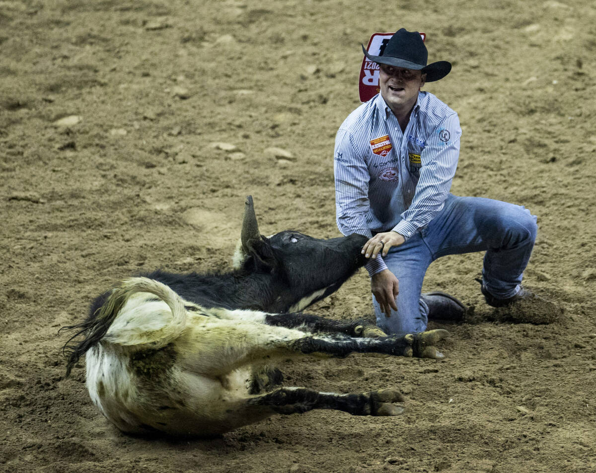 Tristan Martin of Sulphur, LA., is pleased after downing his animal in Steer Wrestling for firs ...