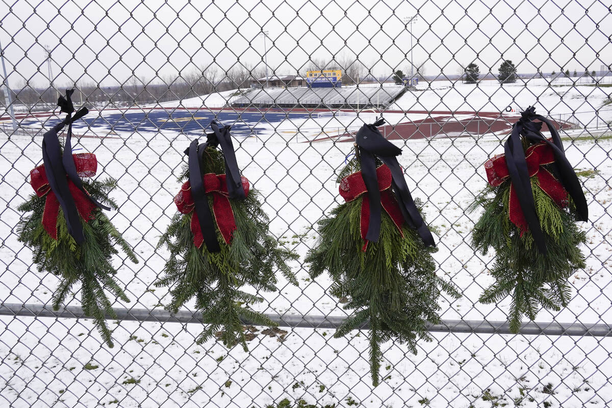 Wreaths with black bows are shown at Oxford High School in Oxford, Mich., Wednesday, Dec. 1, 20 ...