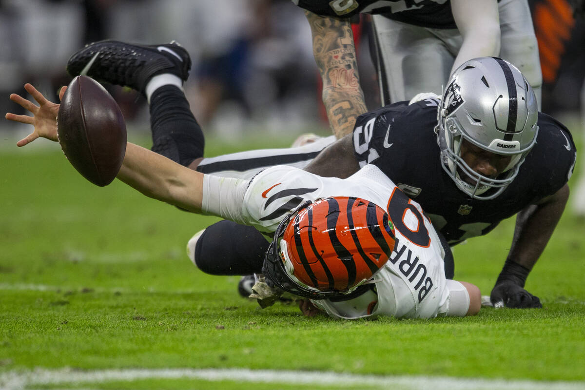 Raiders defensive end Yannick Ngakoue (91) sacks Cincinnati Bengals quarterback Joe Burrow (9) ...
