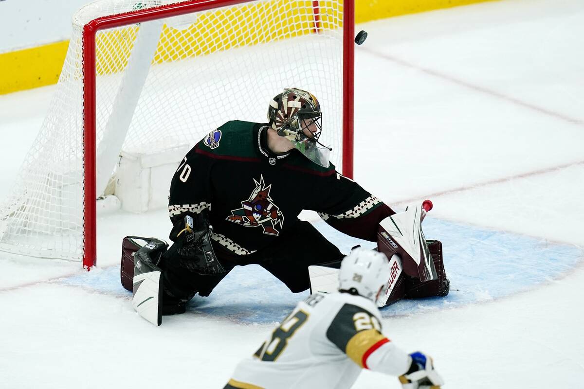 Vegas Golden Knights left wing William Carrier (28) sends the puck just wide of the goal behind ...