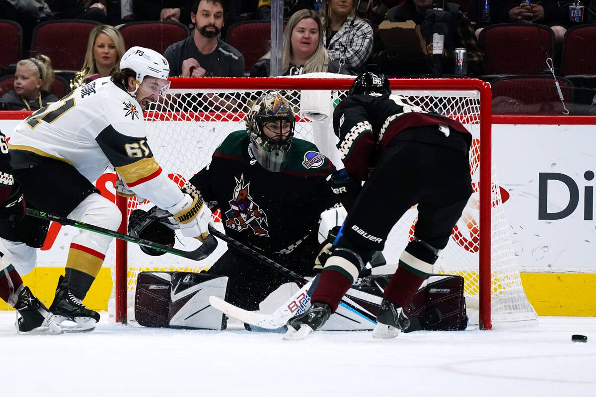 Vegas Golden Knights right wing Mark Stone (61) has his shot stopped by Arizona Coyotes goalten ...