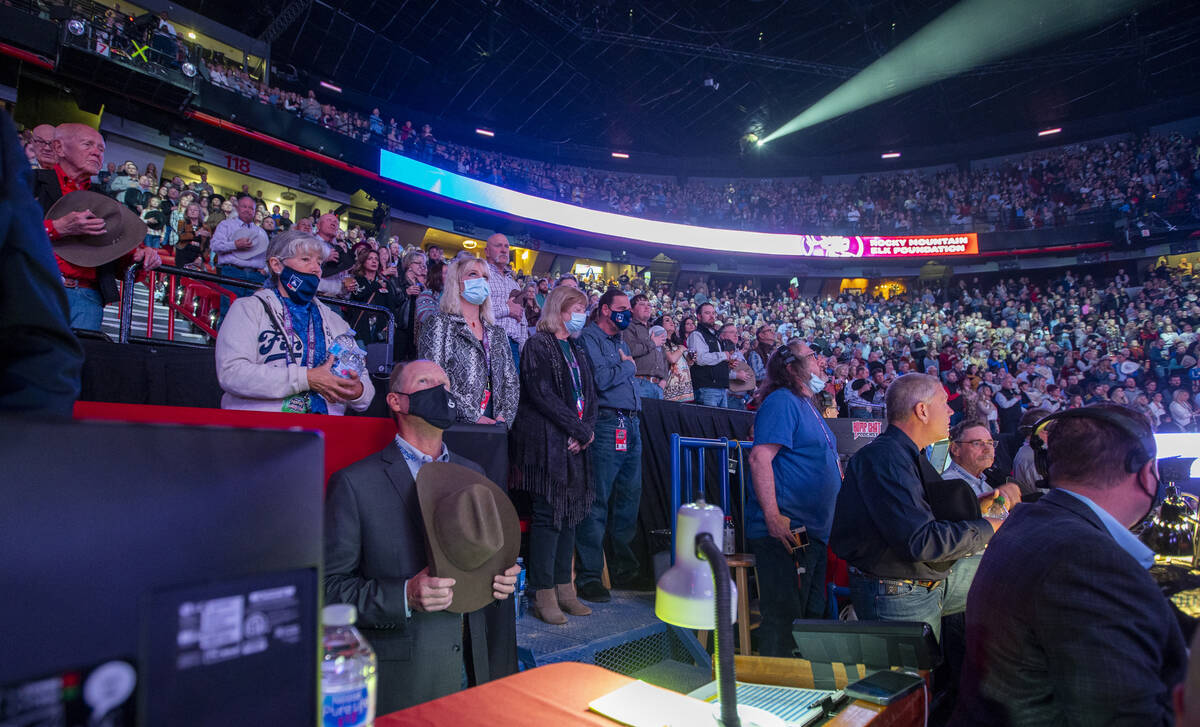 Fans stand for the National anthem during the Day 2 of the Wrangler National Finals Rodeo at th ...