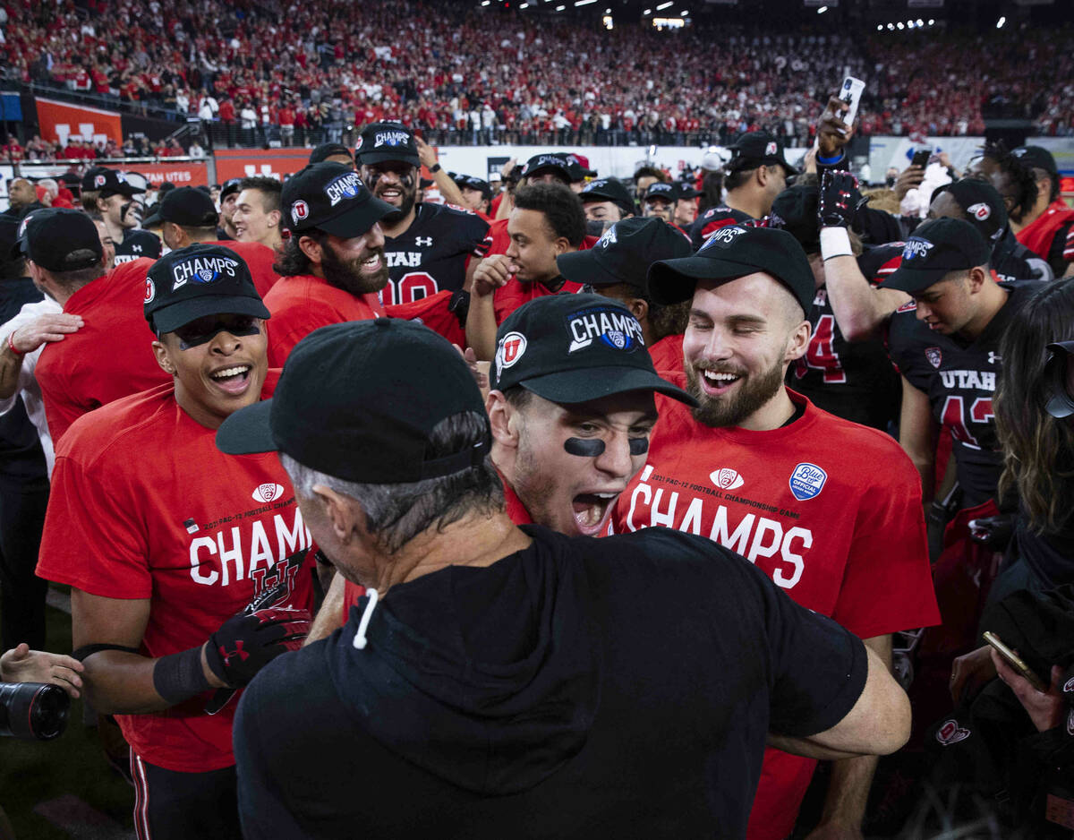 Utah Utes head coach Kyle Whittingham celebrates with his players after beating Oregon Ducks 3 ...