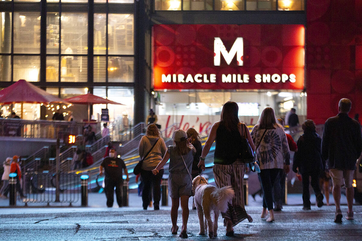 Visitors cross Las Vegas Boulevard toward Miracle Mile Shops on Monday, Nov. 16, 2020, on the L ...
