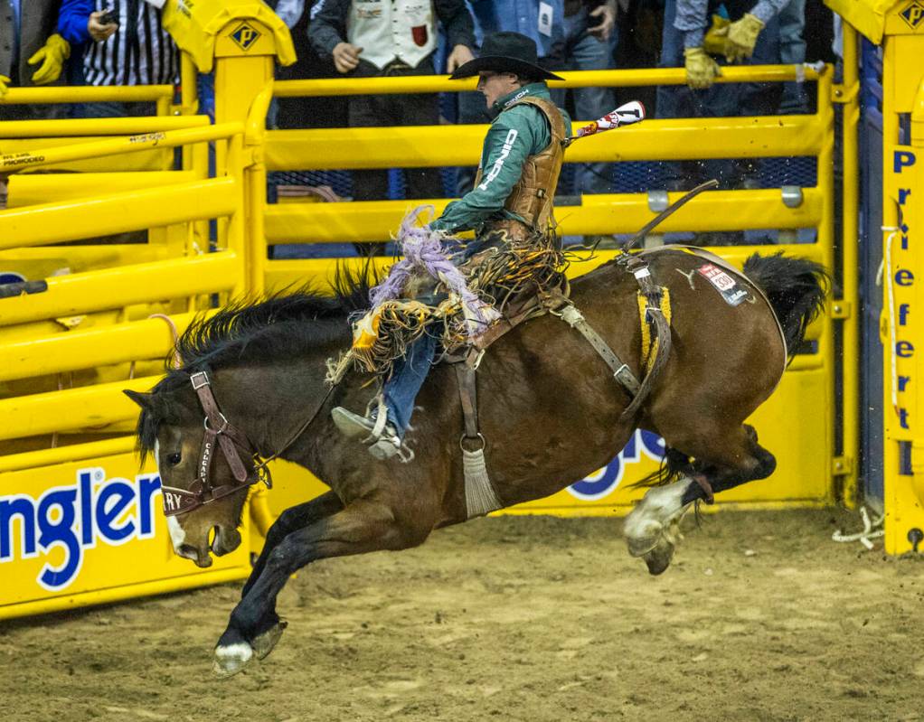 Tegan Smith of Winterset, Iowa, rides Yesterday's Delivery to first place in Saddle Bronc Ridin ...