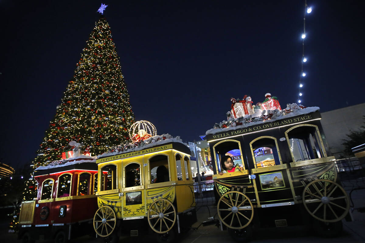 Nana Lee, 3, of las Vegas rides the Jupiter Express Holiday Train at Downtown Summerlin, Friday ...