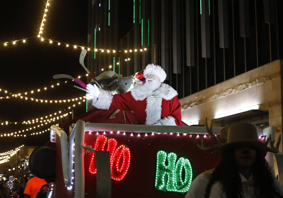 Santa waves during a holiday parade at Downtown Summerlin, Friday, Dec. 3, 2021, in Las Vegas. ...