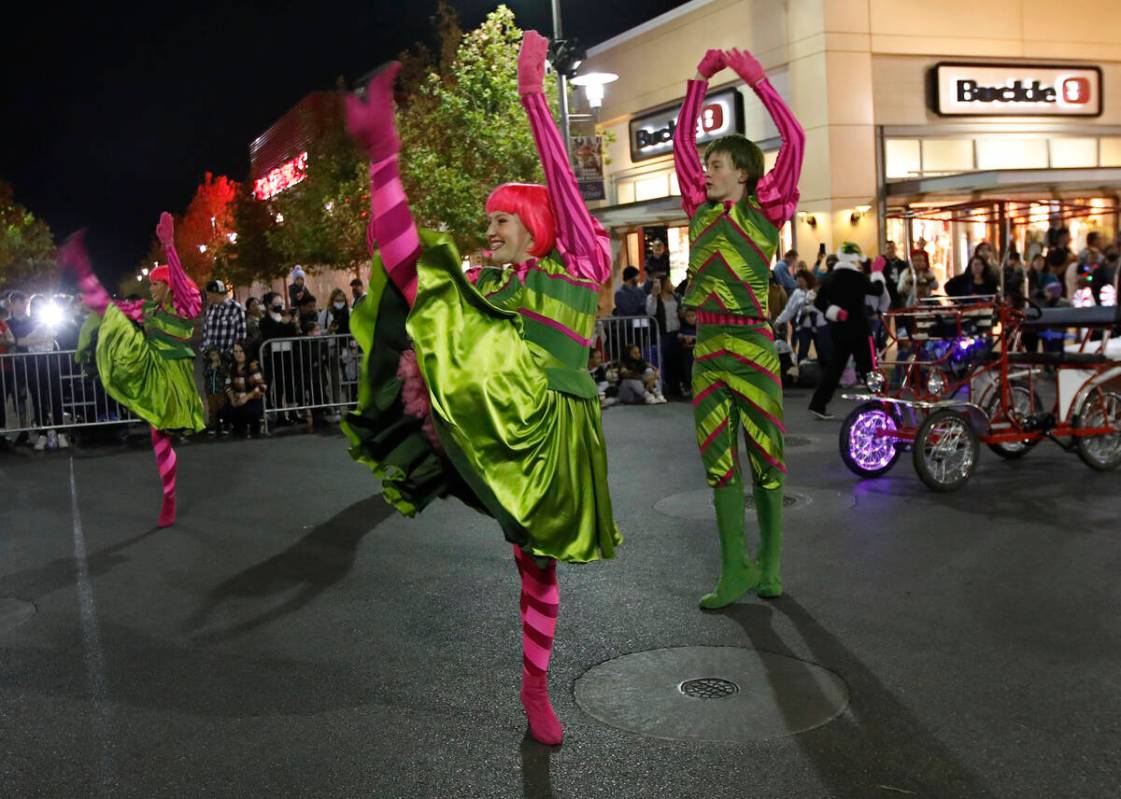 Dancers perform during a holiday parade at Downtown Summerlin, Friday, Dec. 3, 2021, in Las Veg ...