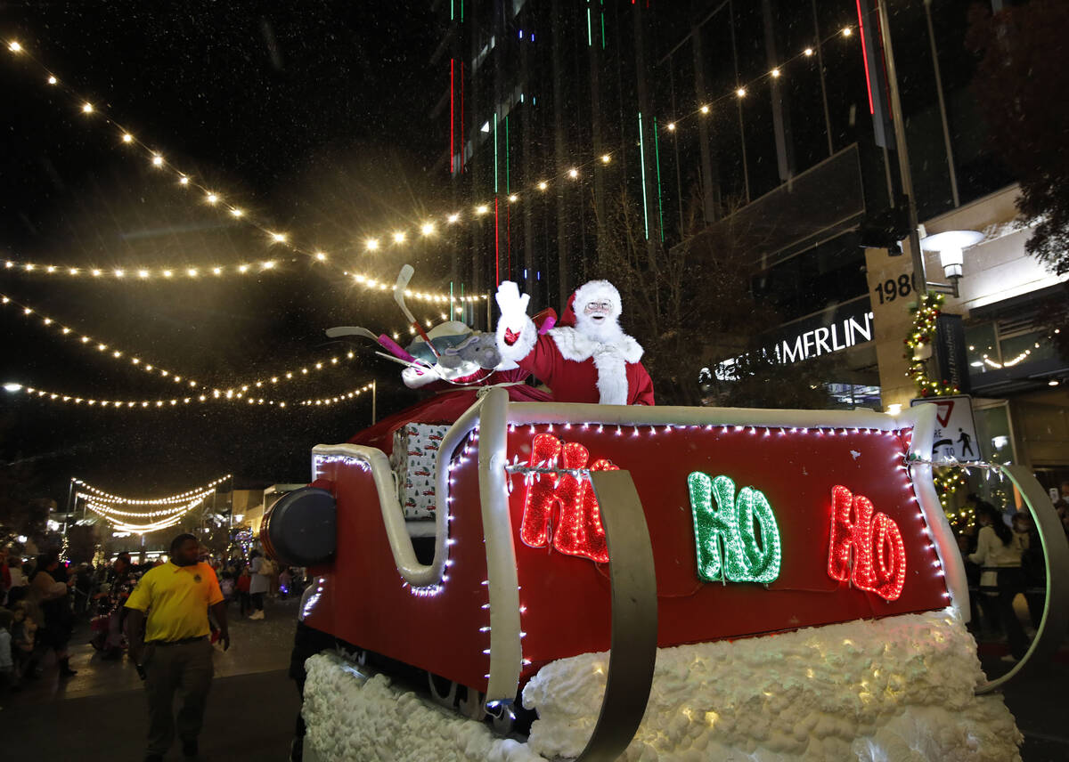 Santa waves during a holiday parade at Downtown Summerlin, Friday, Dec. 3, 2021, in Las Vegas. ...