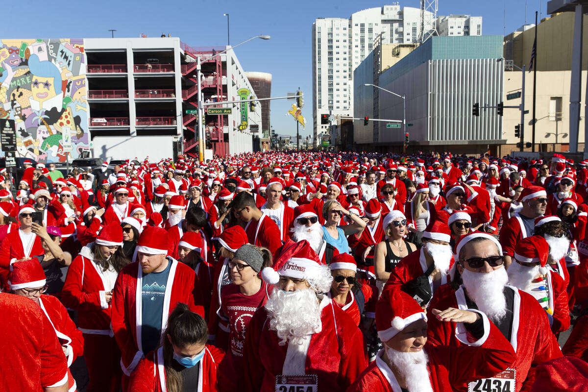 Runners gather at the starting line during The Las Vegas Great Santa Run on Saturday, Dec. 4, 2 ...