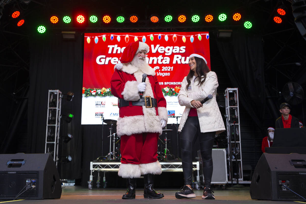 Santa makes an appearance at the pre-race festivities at Fremont Street Experience alongside ev ...