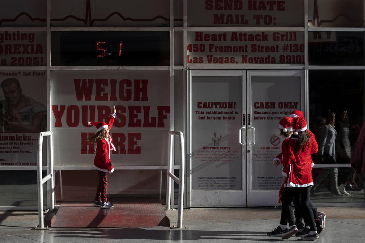 Lainee Villaneuva, 8, weighs in at 51 pounds outside the Heart Attack Grill during The Las Vega ...