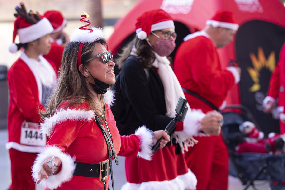 Lynne Carino, of Las Vegas, warms up at Fremont Street Experience before the The Las Vegas Grea ...