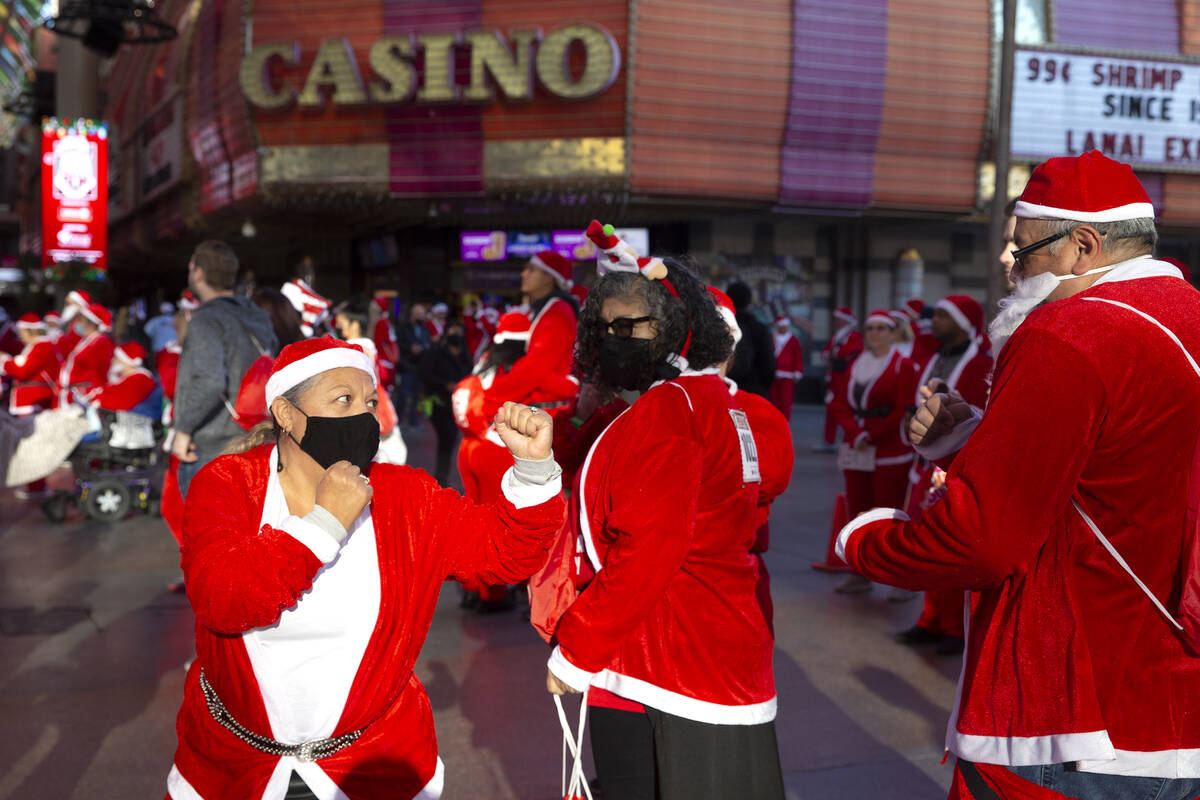 Lannette Hauck, left, play fights with Stephen Paez at Fremont Street Experience during The Las ...