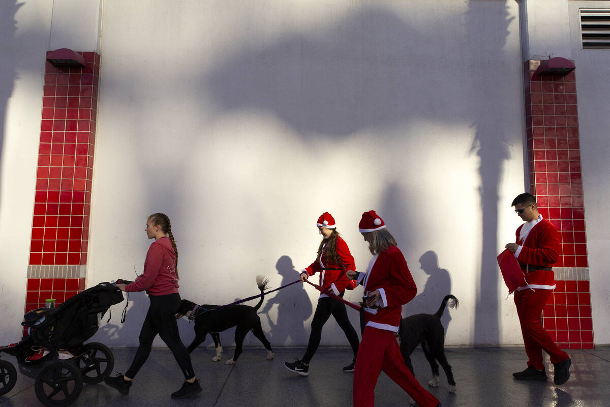 Santas make way to Fremont Street Experience for the festivities during The Las Vegas Great San ...