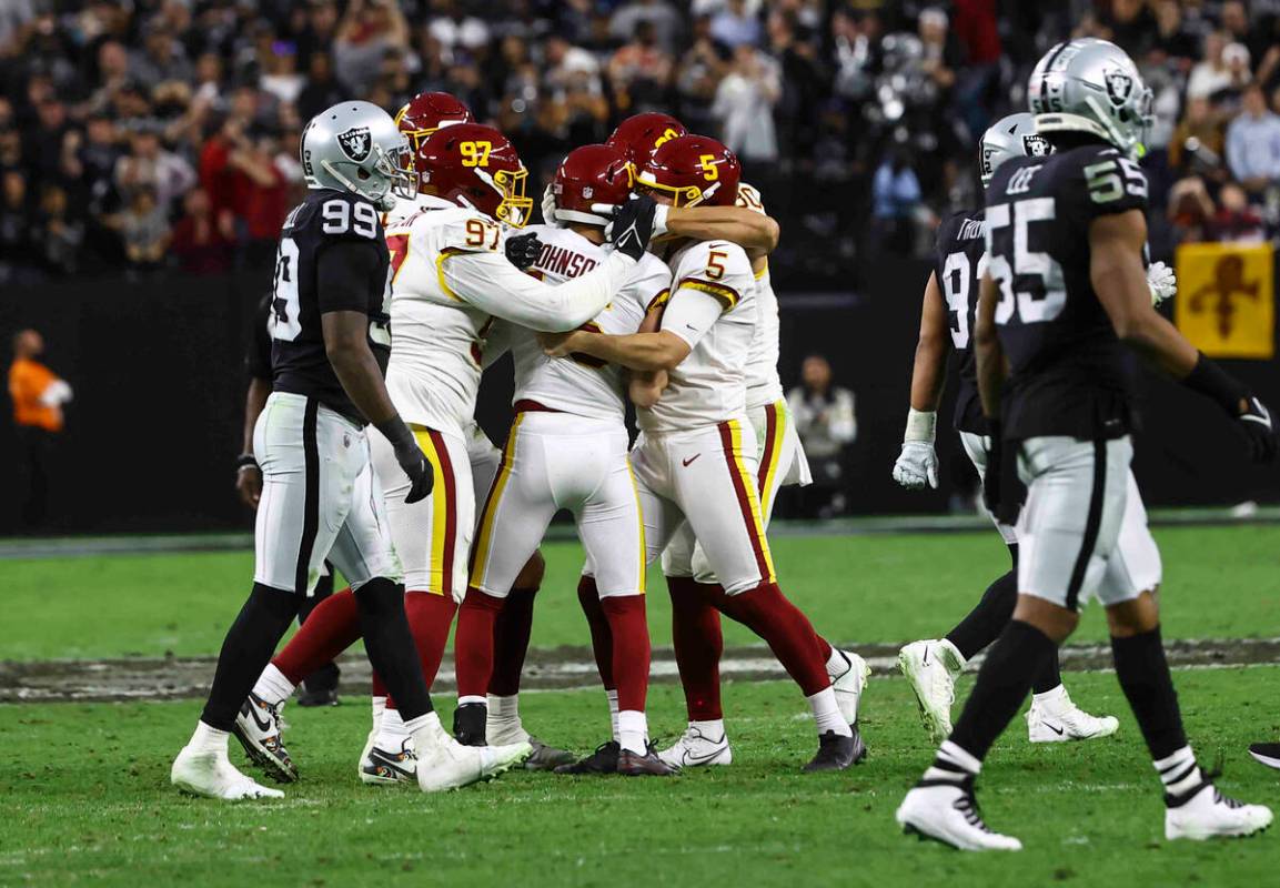 The Washington Football Team celebrates after a field goal putting them ahead of the Raiders 17 ...