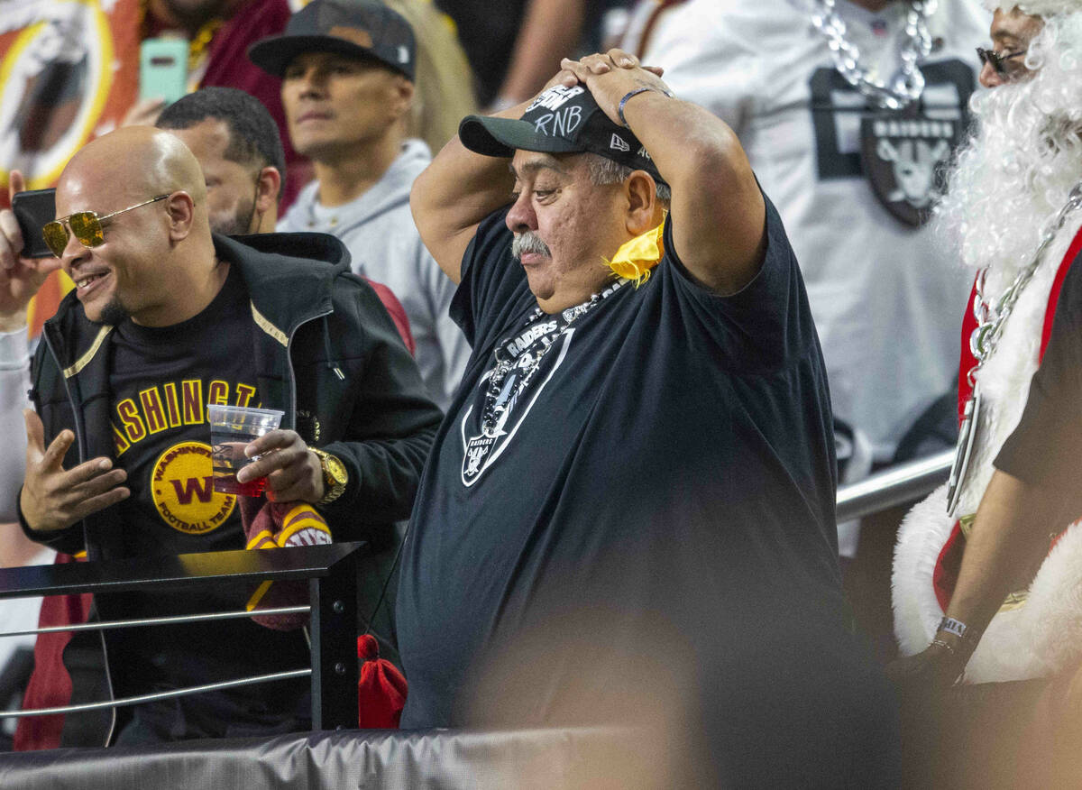 A Raiders fan reacts after the Washington Football Team scored a touchdown during the fourth qu ...
