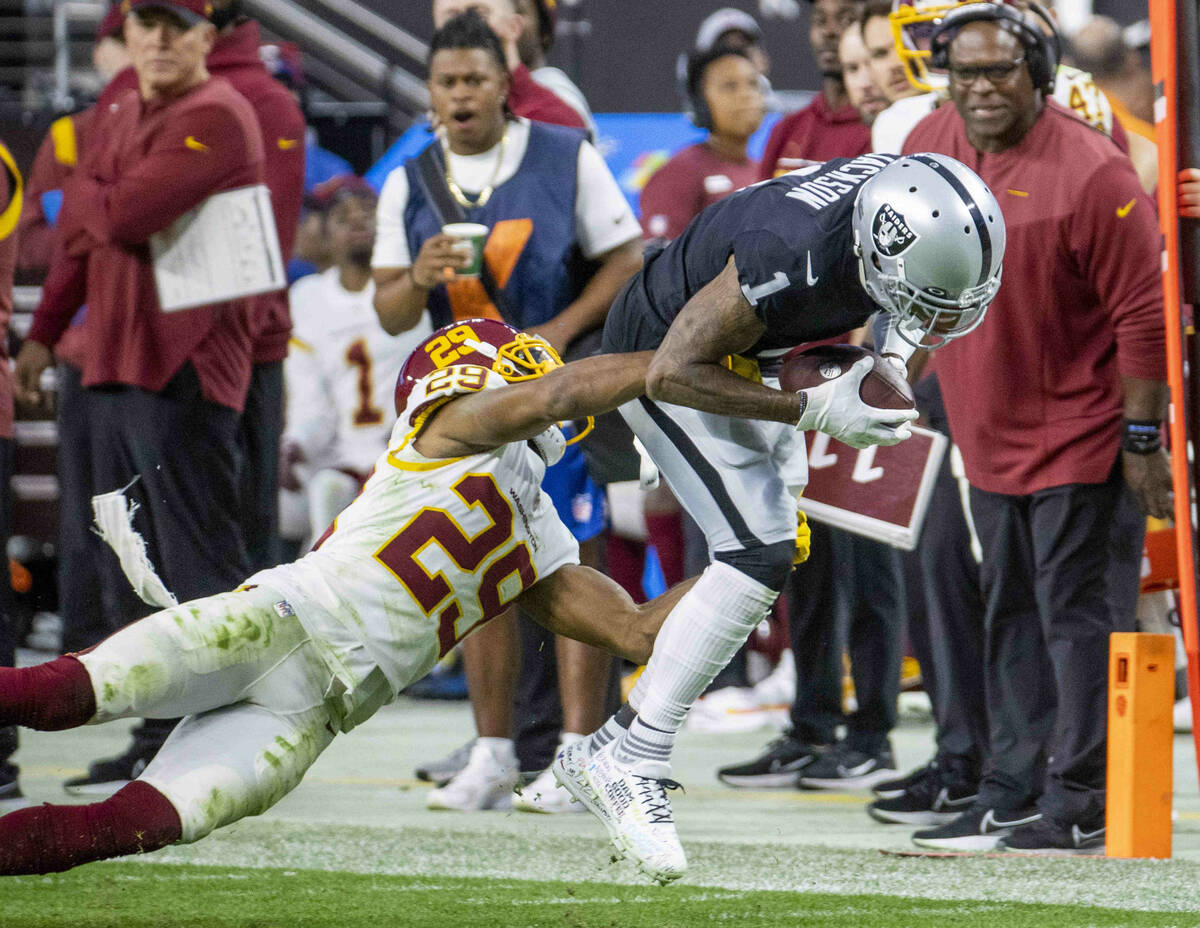 Raiders wide receiver DeSean Jackson (1) hauls in a long pass over Washington Football Team cor ...