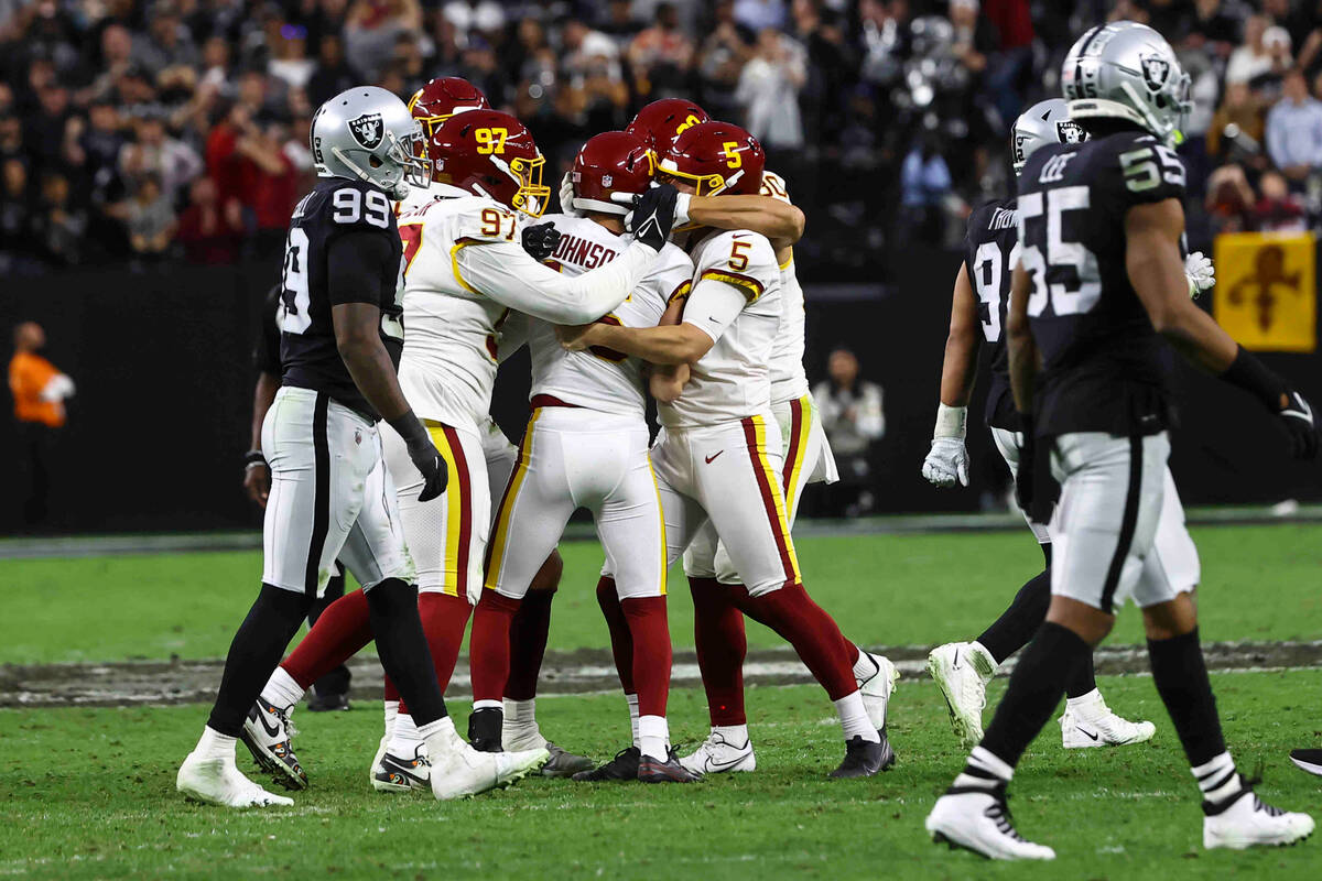 The Washington Football Team celebrates after a field goal putting them ahead of the Raiders 17 ...