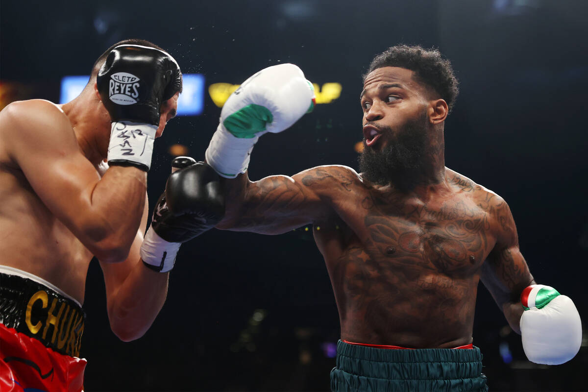 Montana Love, right, throws punch against Carlos Diaz in first round of a super lightweight bou ...