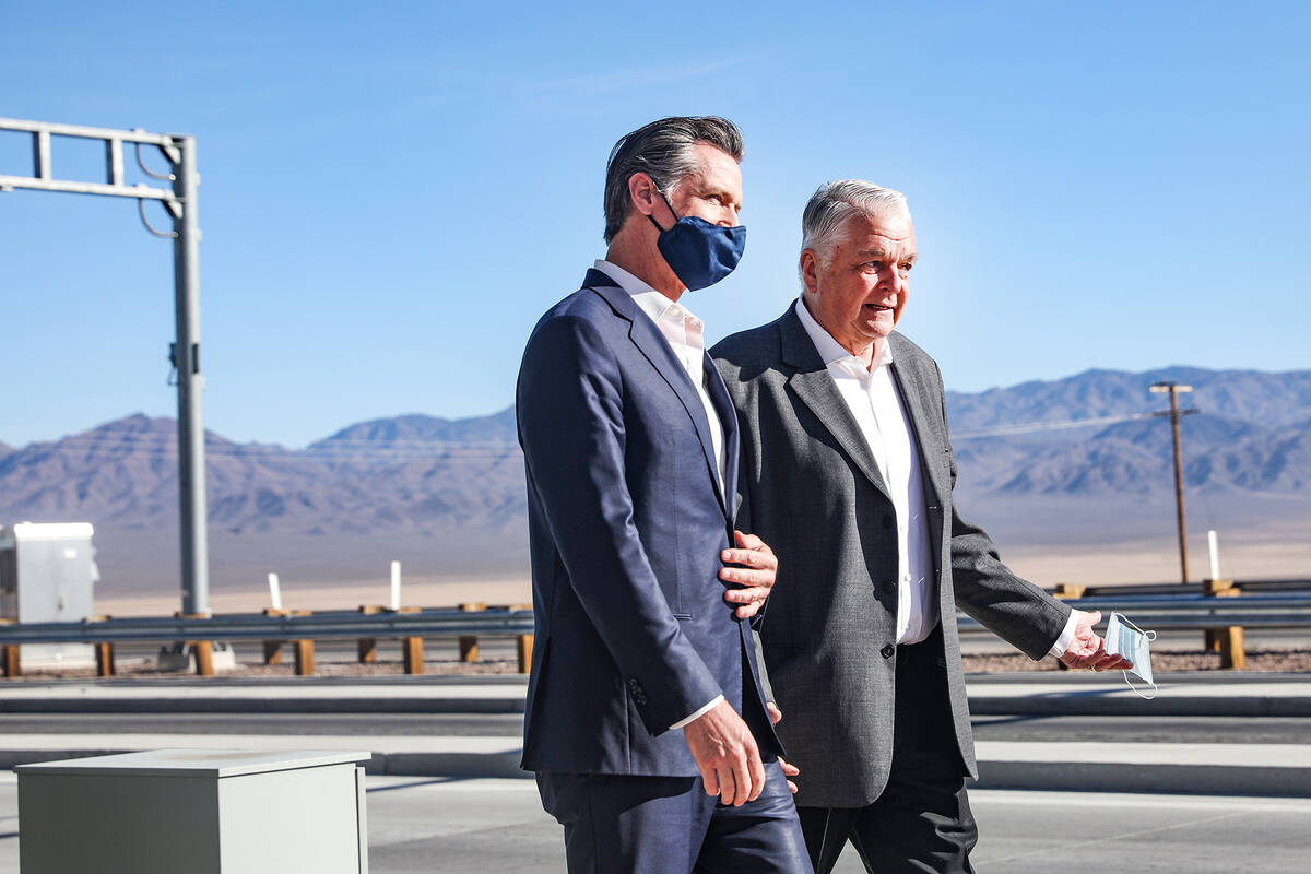 California Gov. Gavin Newsom, left, and Nevada Gov. Steve Sisolak, right, walk to the podium at ...