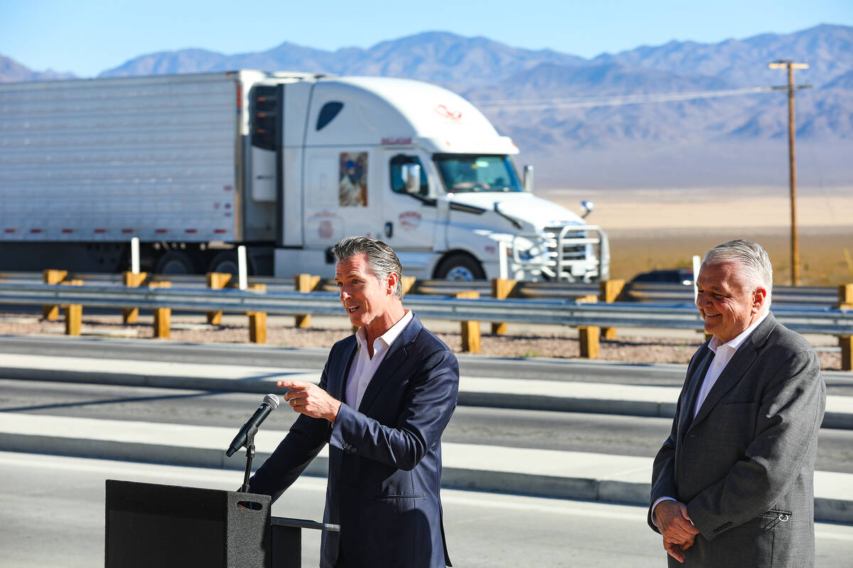 California Gov. Gavin Newsom addresses the media next to Nevada Gov. Steve Sisolak at a press c ...