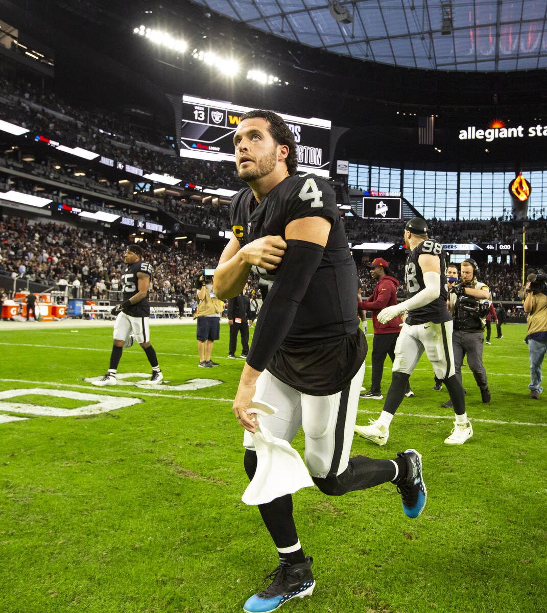 Raiders quarterback Derek Carr (4) leaves the field after a 17-15 loss to the Washington Footba ...