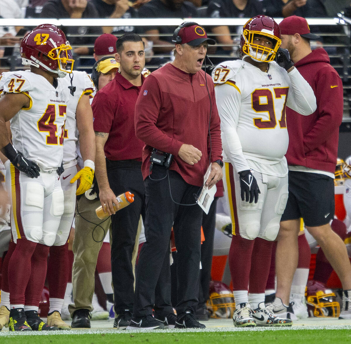 Washington Football Team defensive coordinator Jack Del Rio, center, shouts on the sideline dur ...