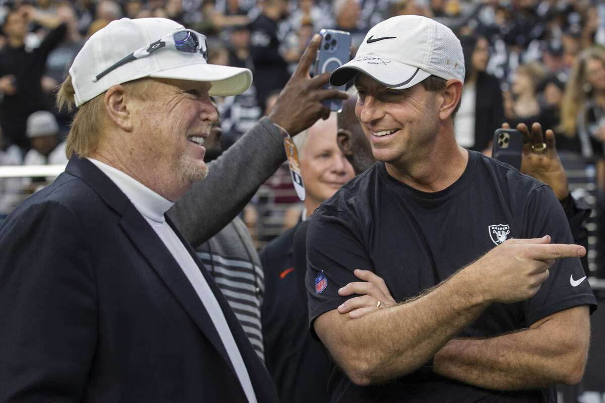 Clemson head football coach Dabo Swinney, right, talks with Raiders owner Mark Davis before the ...