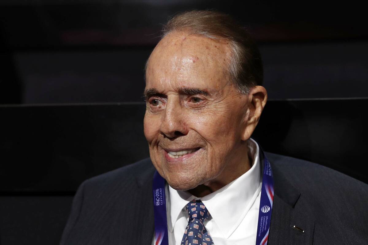 FILE - Former Republican presidential candidate Sen. Bob Dole arrives at the Quicken Loans Aren ...