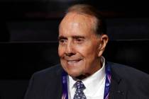 FILE - Former Republican presidential candidate Sen. Bob Dole arrives at the Quicken Loans Aren ...