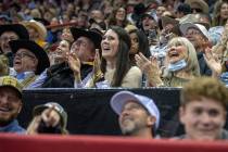 The crowd laughs and sings along to a song during the Day 2 of the Wrangler National Finals Rod ...