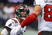 Tampa Bay Buccaneers quarterback Tom Brady celebrates with tight end Rob Gronkowski after the t ...