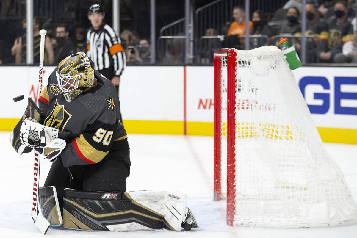 Vegas Golden Knights goaltender Robin Lehner (90) saves a shot on goal by the Calgary Flames du ...