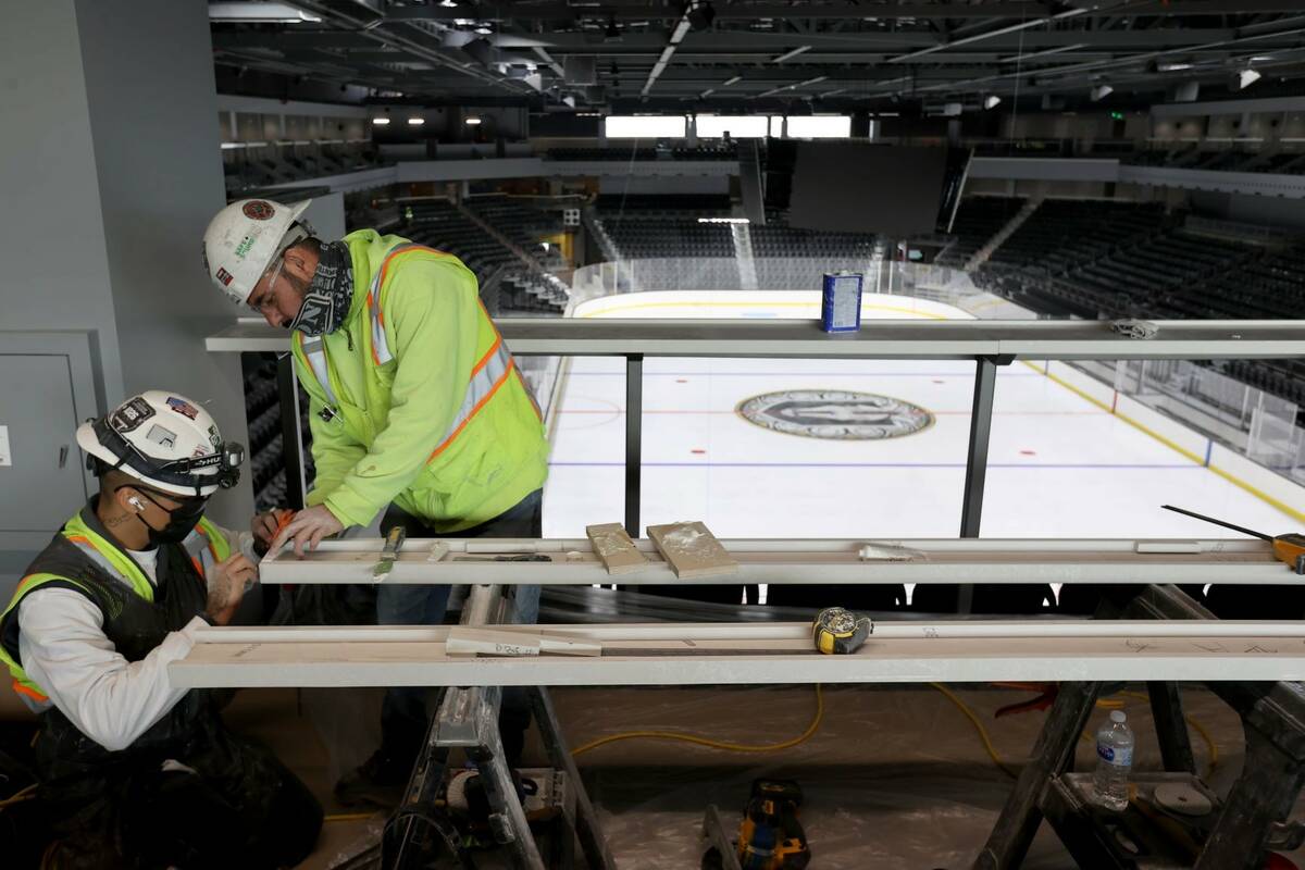 Workers on the Royal Landing premium level at the Dollar Loan Center during a tour of the new S ...