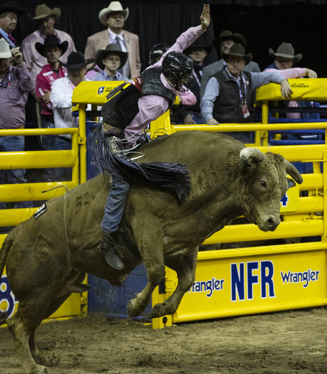 Creek Young of Rogersville, Mont., rides CliffHanger during the 5th  circular  of the Wrangler Nat ...