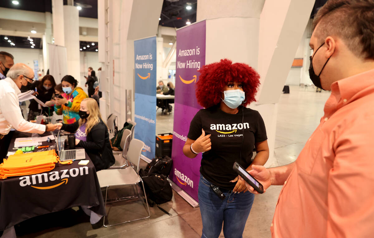 Jalyn Anderson of Amazon talks to job seeker Illya Prikhodko of Las Vegas during JobFest 2021 a ...