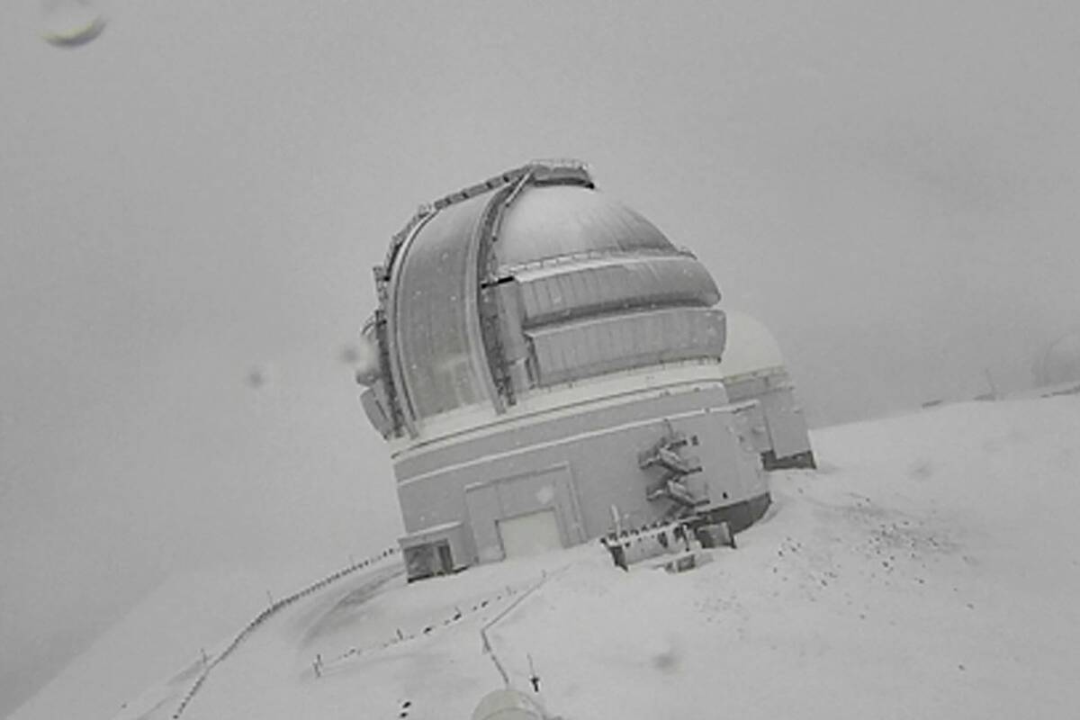 Snow is seen atop the summit of Mauna Kea in Hawaii on Monday, Dec. 6, 2021. (Canada-France-Haw ...