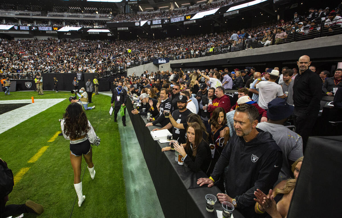 Football fans hang out at the Wynn Field Club during an NFL game between the Raiders and the Wa ...