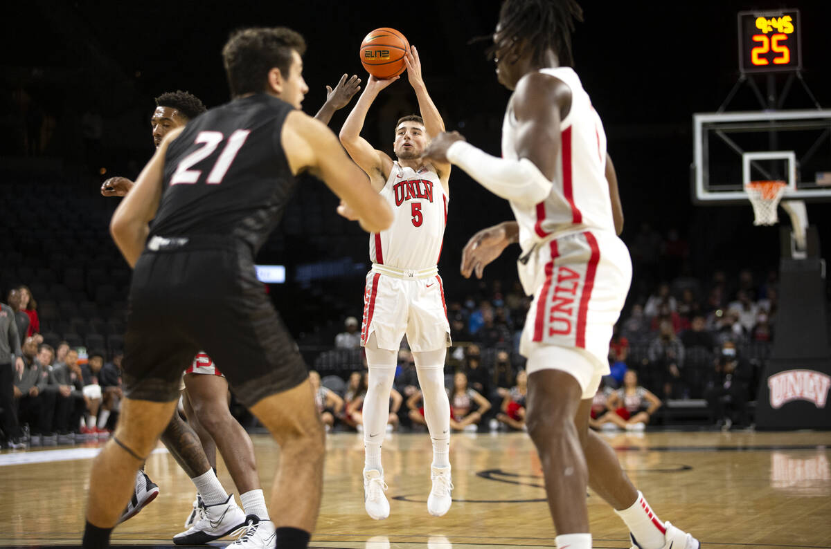 UNLV Rebels guard Jordan McCabe (5) attempts a three-pointer during the first half of an NCAA m ...