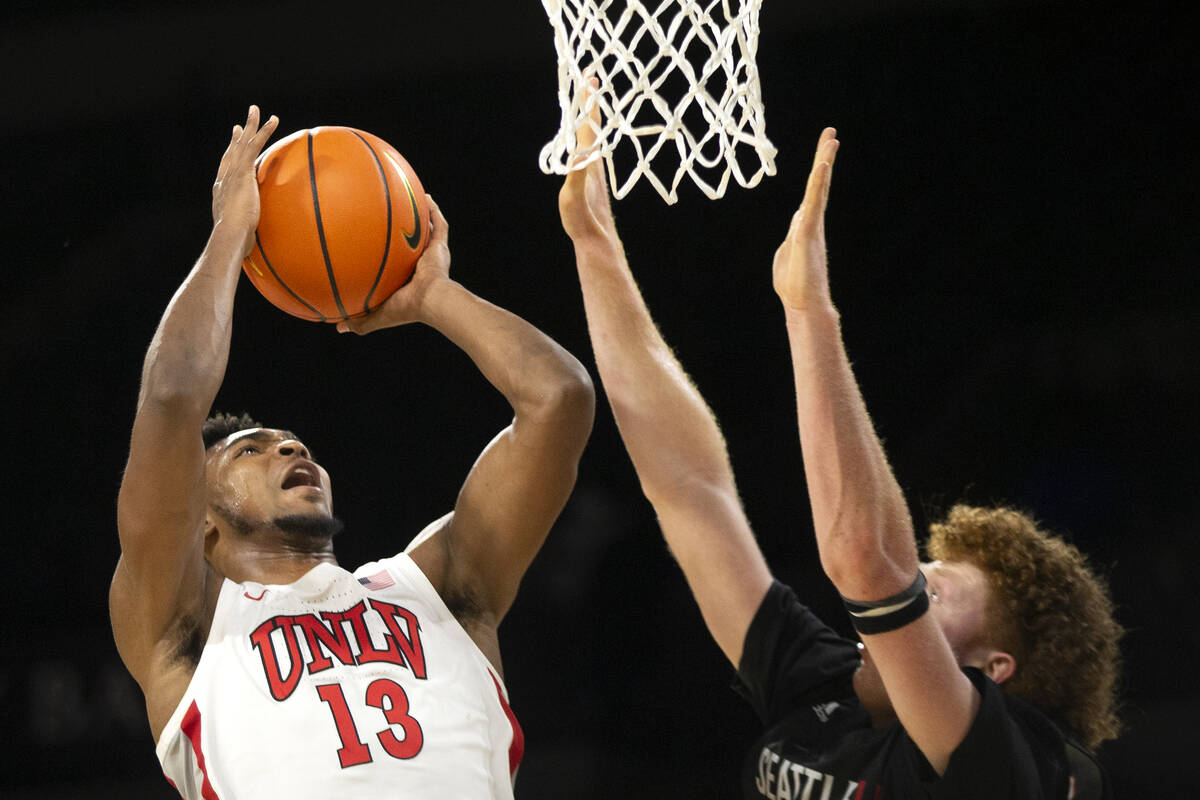 UNLV Rebels guard Bryce Hamilton (13) shoots against Seattle Redhawks guard Kobe Williamson (33 ...