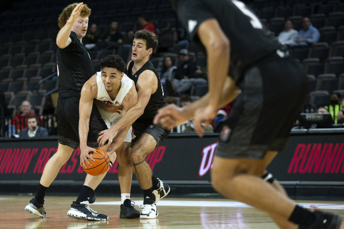 UNLV Rebels guard Marvin Coleman (31) looks to pass while Seattle Redhawks guard Kobe Williamso ...