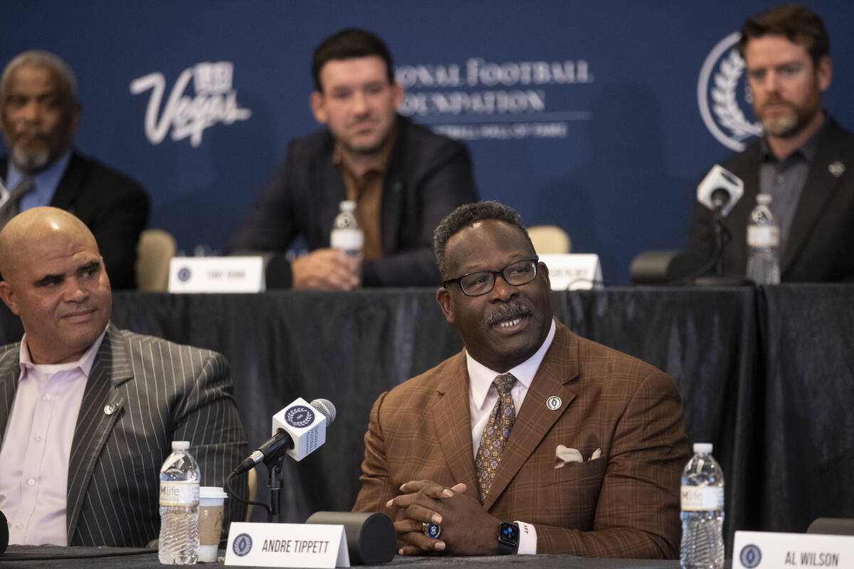Inductee Andre Tippett, center, speaks during the College Football Hall of Fame introduction ce ...
