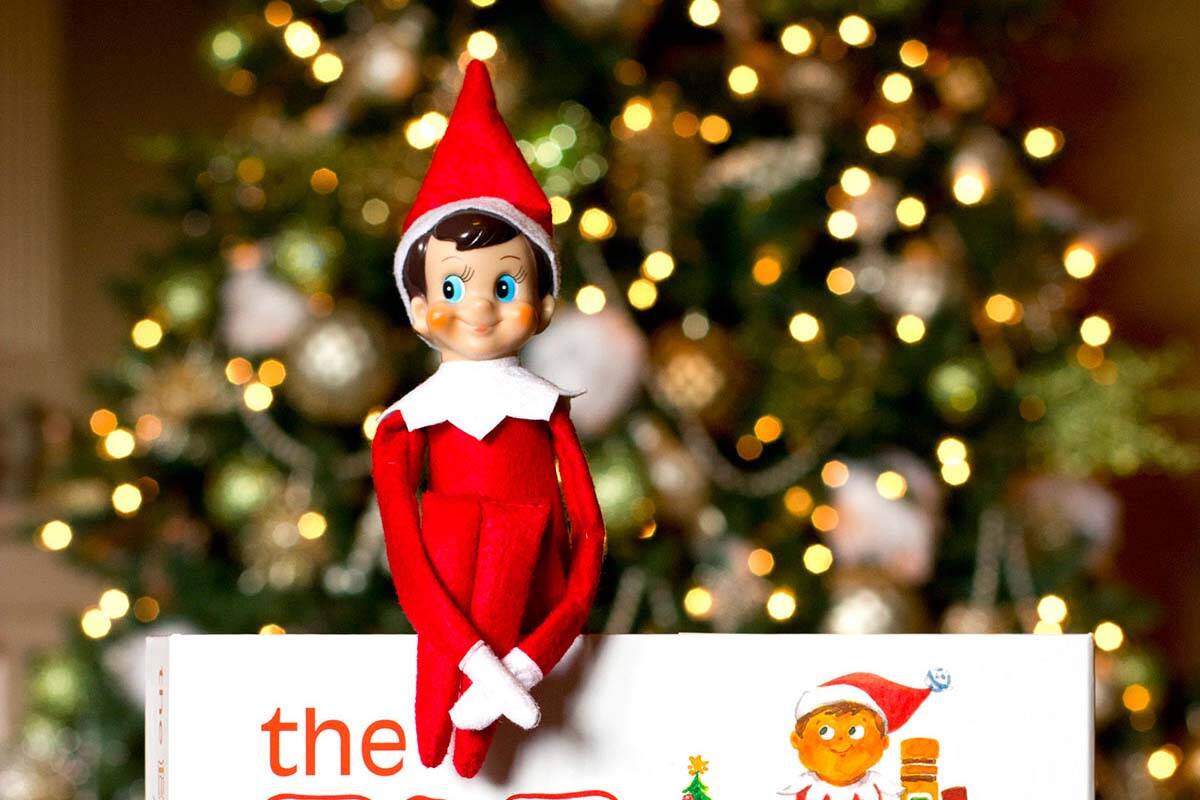 "The Elf on the Shelf: A Christmas Tradition" involves a picture book and a stuffed, felt elf t ...