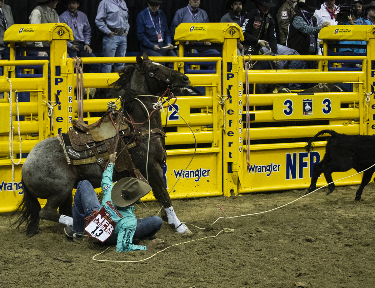 Shad Mayfield of Clovis, N.M., fell from his horse in Tie-Down Roping during the sixth round of ...