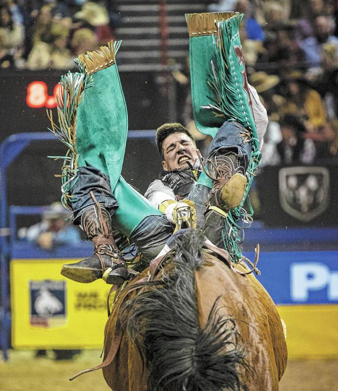 Jess Pope of Waverly, Kan., rides Irish Eyes in Bareback Riding during the sixth round of the W ...