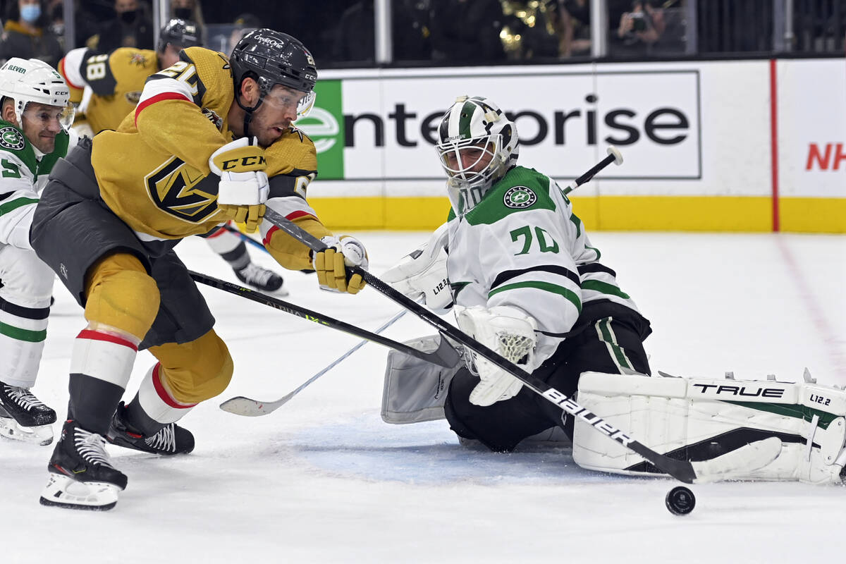 Vegas Golden Knights center Chandler Stephenson (20) shoots against Dallas Stars goaltender Bra ...