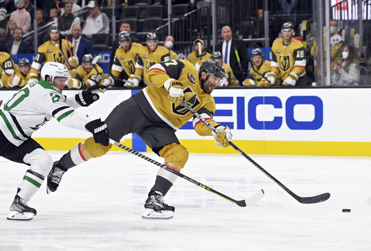 Vegas Golden Knights left wing Max Pacioretty (67) shoots next to Dallas Stars defenseman Ryan ...