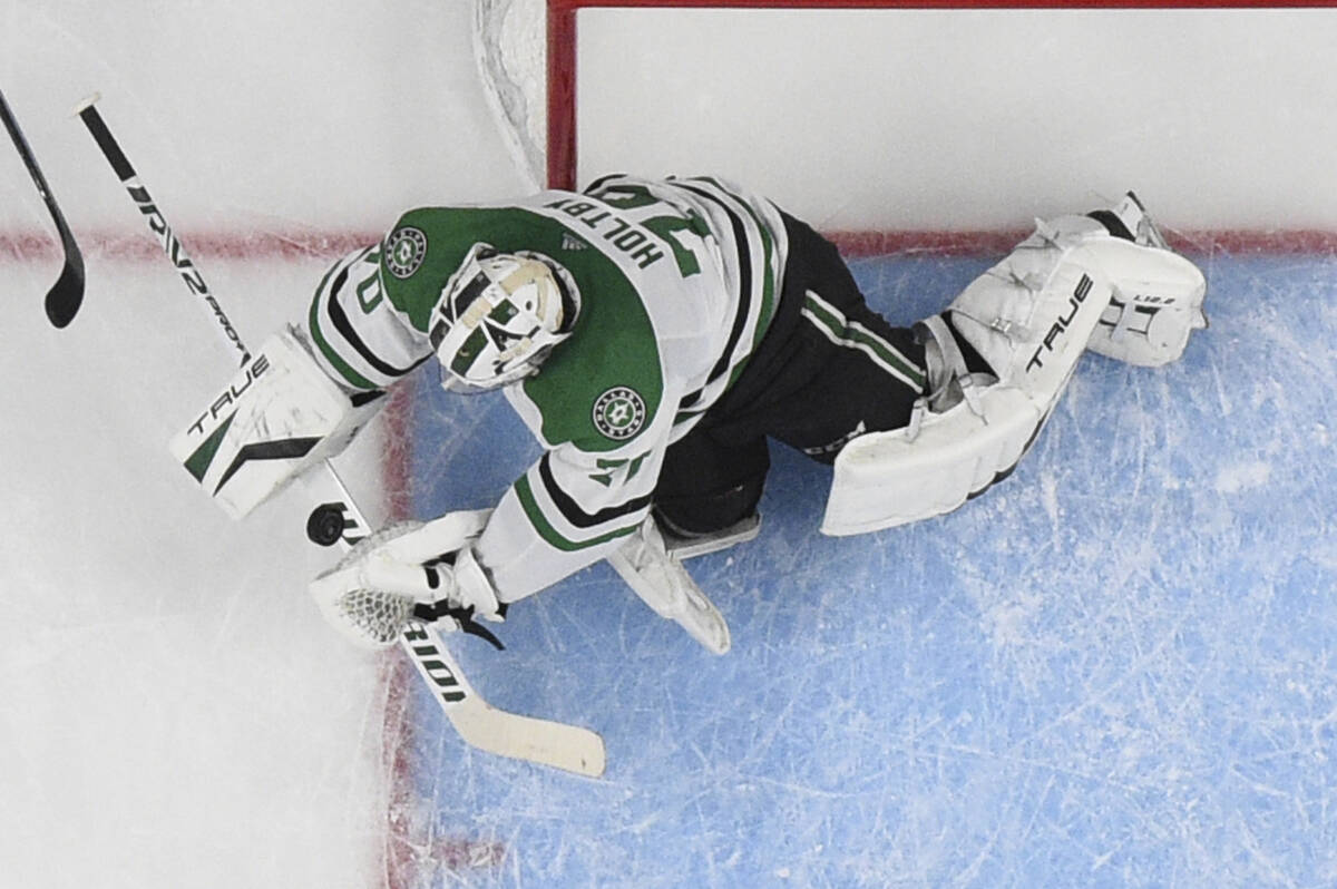 Dallas Stars goaltender Braden Holtby stops the puck during the first period of the team's NHL ...